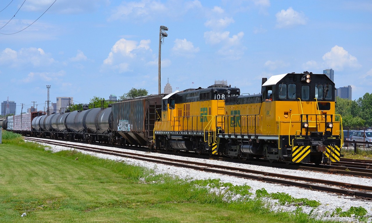 ETR 104 & 108 haul a pretty long train beside the Windsor CP Yard with the Detroit skyline in the background.