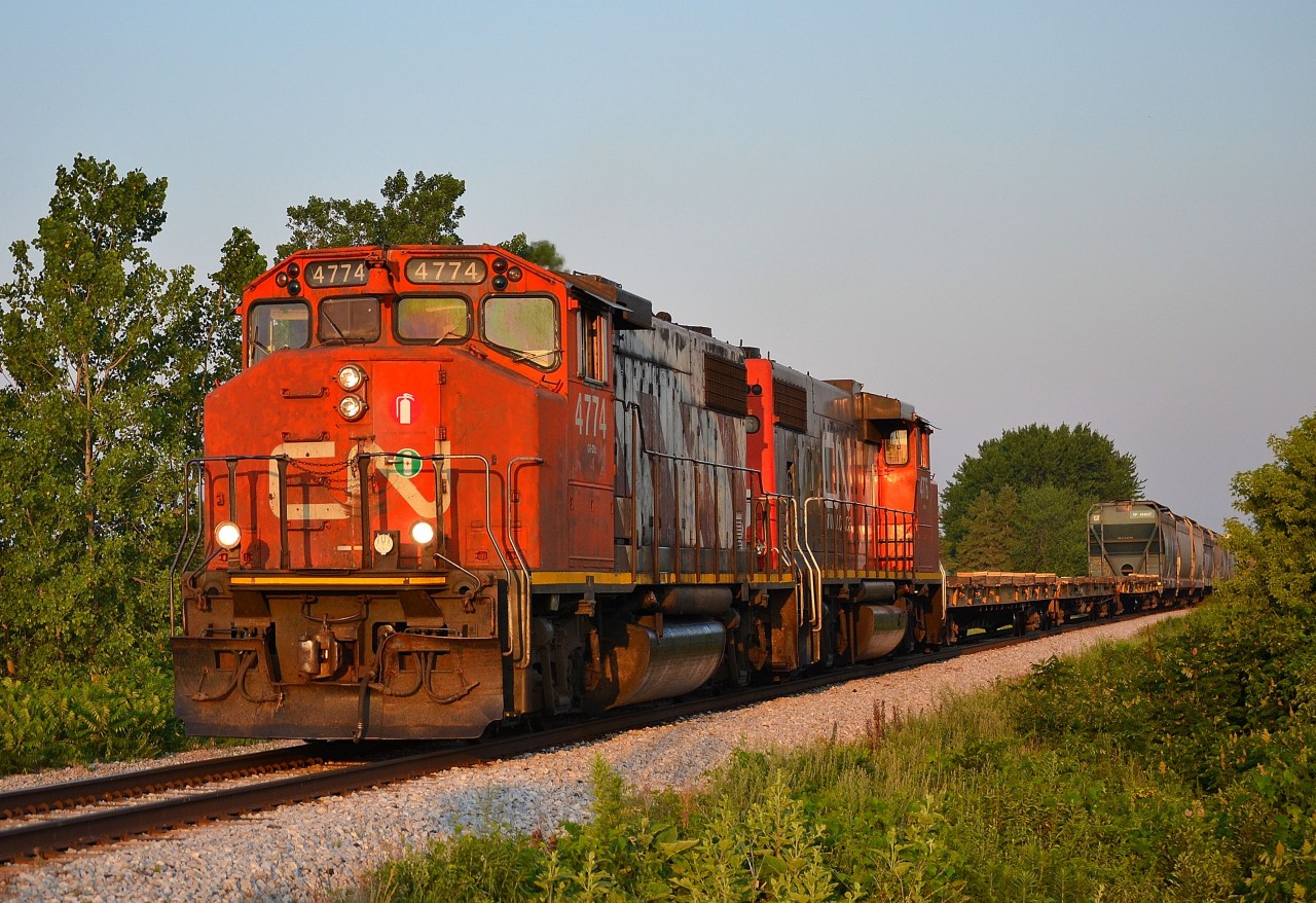 CN 438 led by a pair of GP38-2Ws, passes thru Jeannettes Creek on its way towards London in the 6:30am morning sun.