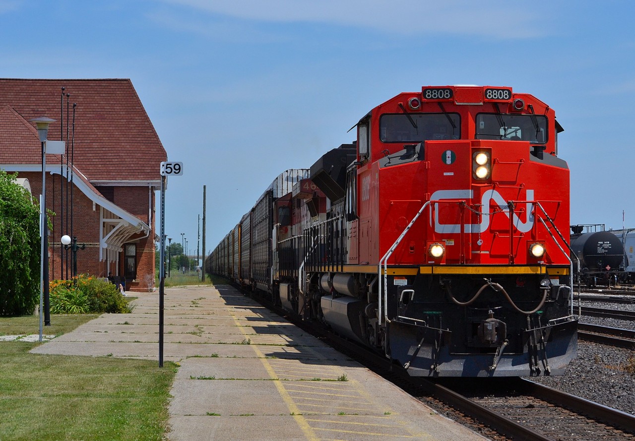 CN 393 led by 8808 rolls by the Sarnia VIA station on its way toward the tunnel to Port Huron
