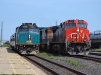 CN 501 proceeds towards the tunnel to Port Huron as VIA 85 waits for him to pass by so it can go wye its train.