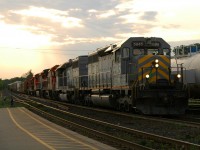 434 passing by the Brantford Yard with a consist of GTW 5945 - GTW 5940 - CN 2129 - CN 2676 - CN 7039 - CN 1412