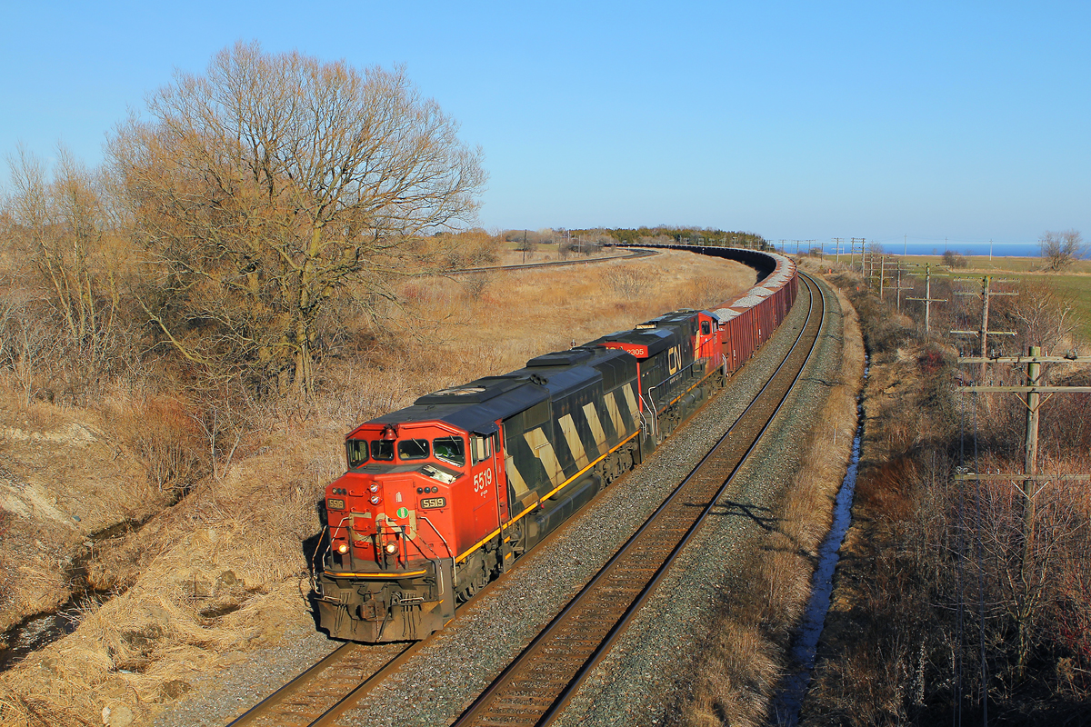 In response to Eric\'s posting of O493, here\'s my shot, albeit a tad wider, of CN\'s O49321 08 bound for London Jct passing Lovekin with an draper taped\' SD60F and a GEVO. If SD60F\'s are what you desire, I suggest heading west to Alberta.