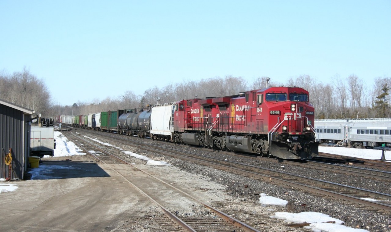 A pair of AC4400CW locomotives charge through Guelph Junction at the head of an eastbound freight.