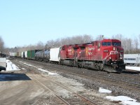 A pair of AC4400CW locomotives charge through Guelph Junction at the head of an eastbound freight.