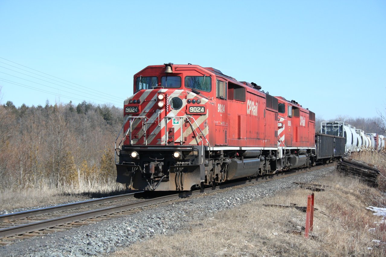 A matched pair of CP SD40-2F \"Red Barns\" lead a westbound freight near Puslinch siding.
