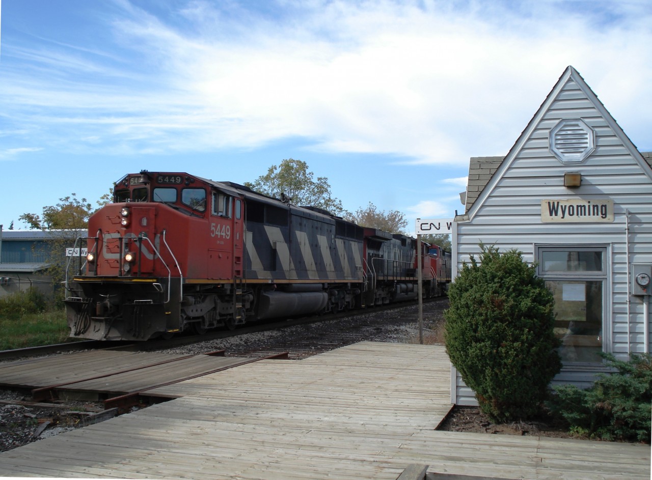 CN #5449 leads two others past the depot at Wyoming Ontario