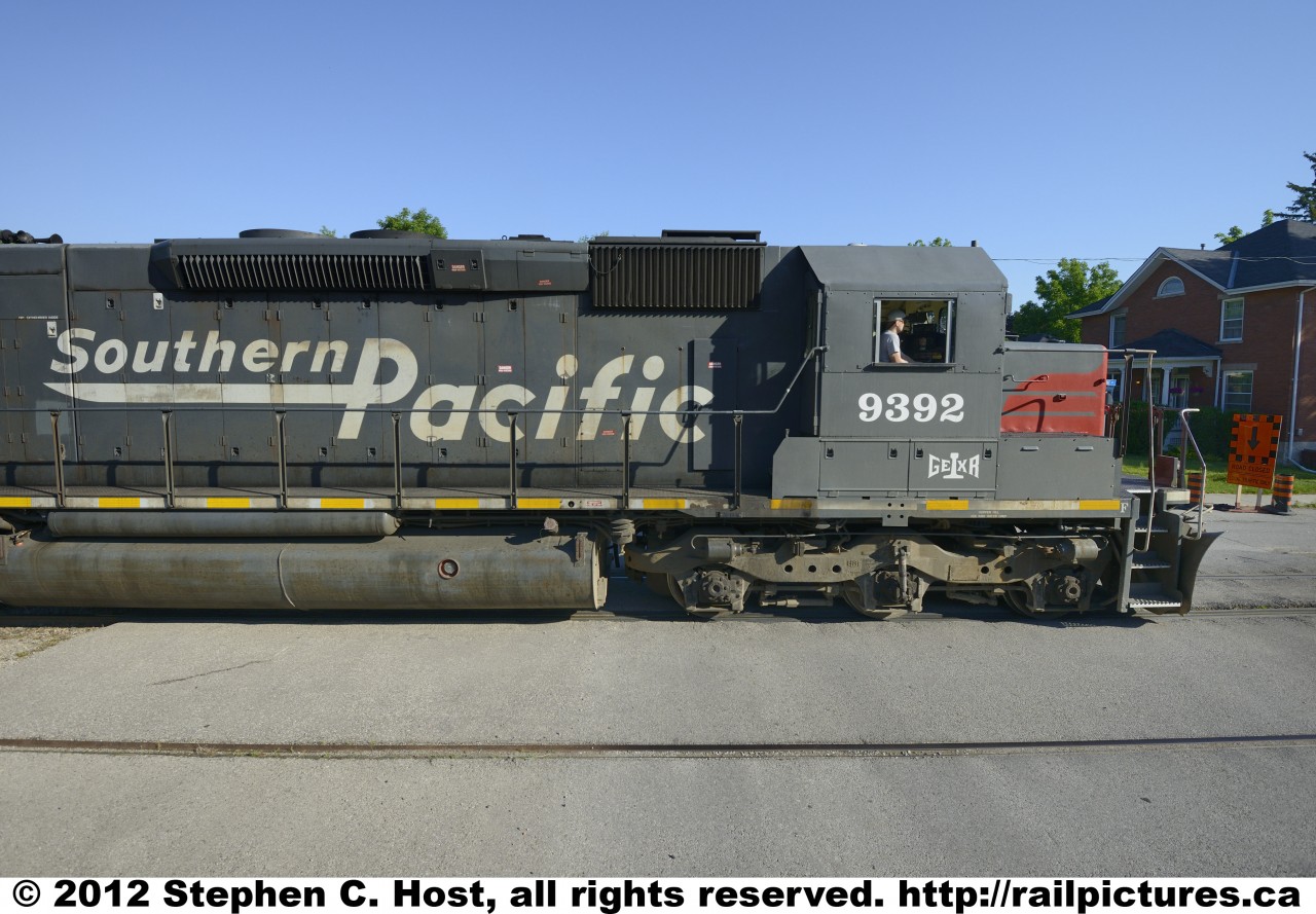 A wide angle (16mm)   study in the Southern Pacific heritage of GEXR 9392 (ex SP 9392) as it enters the Street Running along Kent St. in Guelph, Ontario, Canada. Lucky for SP fans, this engine will survive a few more years with a nearly intact  SP livery after being rebuilt in Goderich, Ontario prior to  entering service in Canada.