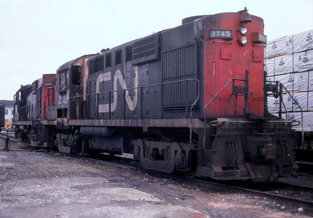 CN 3745 sits on the north side of the Brantford Yard having last been used on train 509. The unit suffered a cab fire and was set out here. Also joining this RS18 is another, CN 3666 which was the power for train 560 based out of the Brantford Yard.