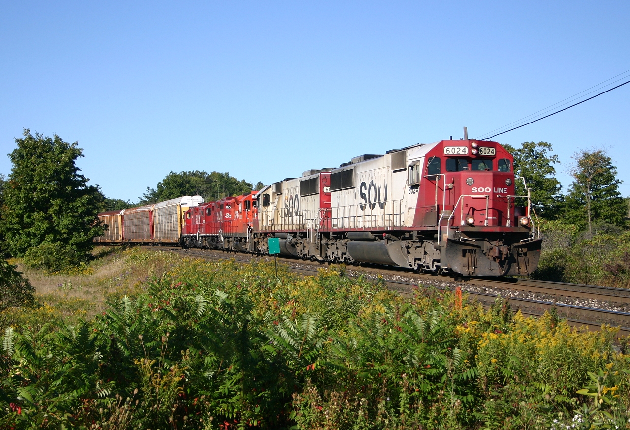 SOO 6024, SOO 6031, CP 8248, StL&H 8223, StL&H 8216 lead an eastbound down the escarpment.