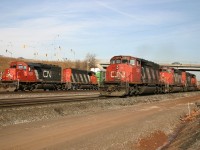 CN 383 blasts by on the main as CN 393 works Aldershot Yard.