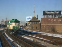 GO 543 shoves an inbound train past the Cherry Street tower, seen from an Oshawa bound GO train