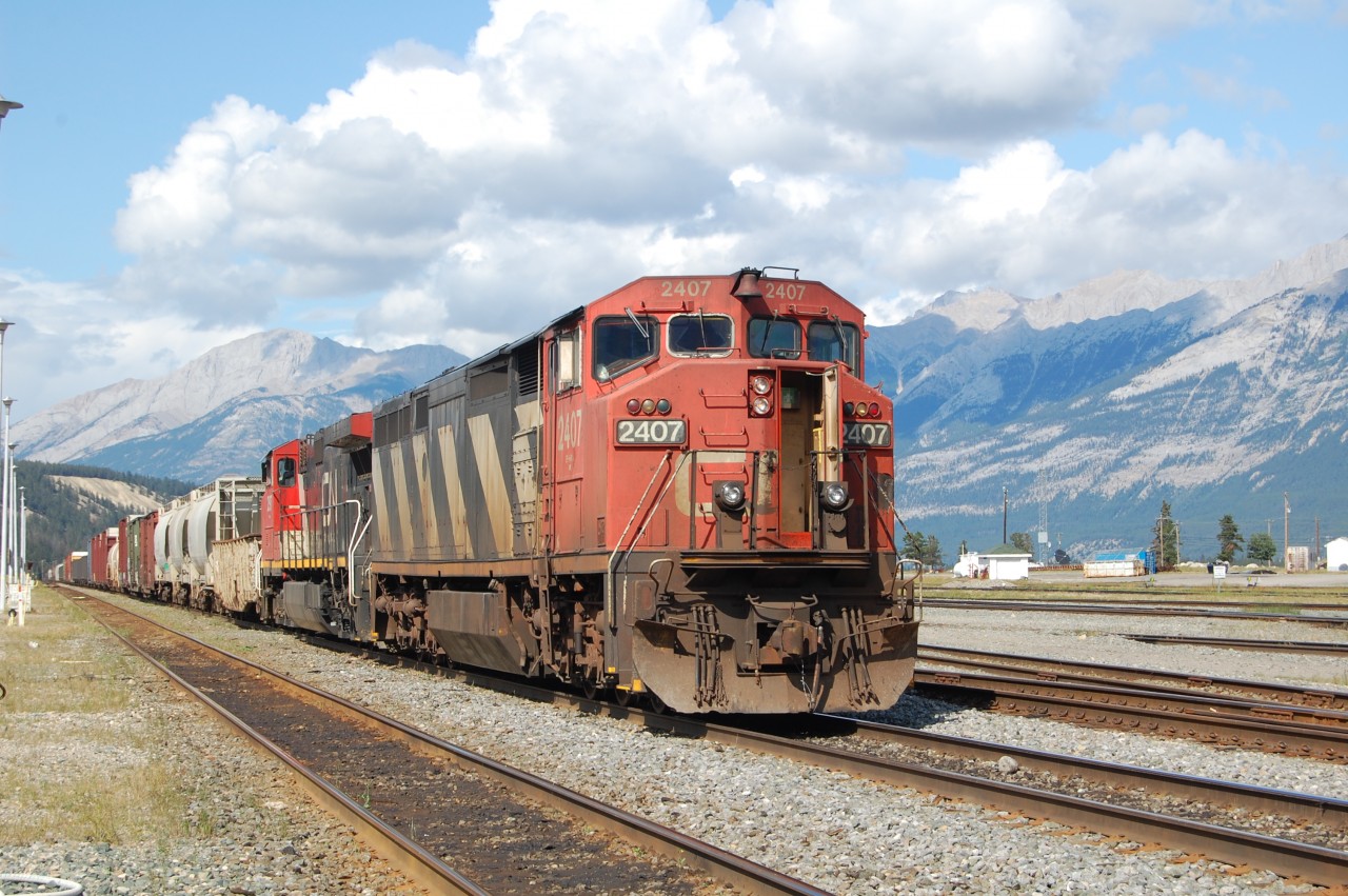 A general freight sitting in the yard before its departure from Jasper yard. Loco CN Dash 8-40cm #2407 lead this train.