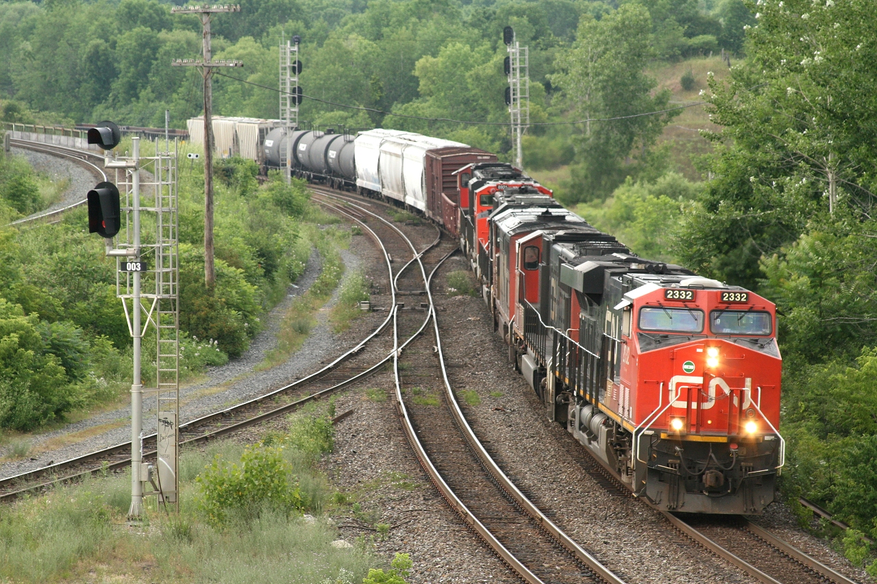 CN 148 comes off the hill with 6 units; CN 2332, CN 5736, CN 2401, IC 1020, CN 8921 and CN 5680