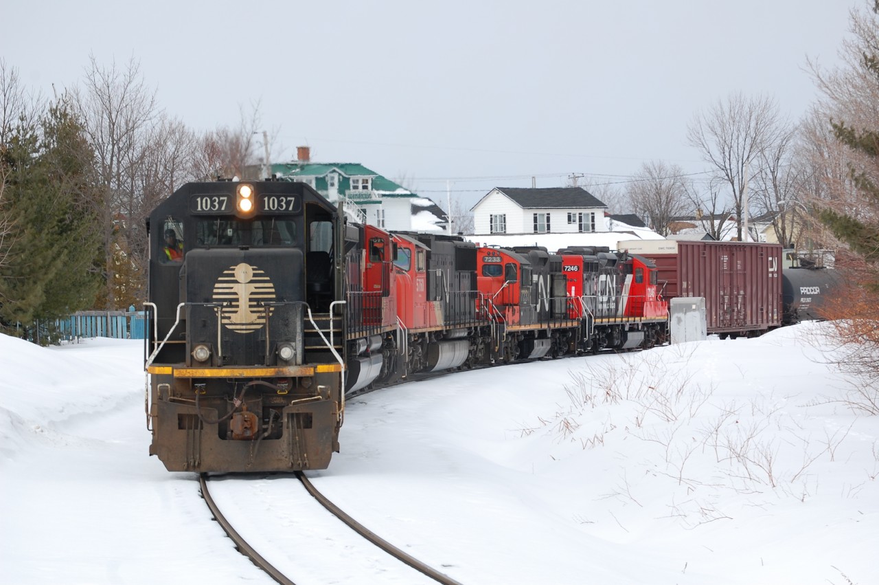 CN 520 was wheel spine on the Charny village. This IC SD70 #1037 and a CN SD70m-2 was coming to help the CN 520 to climb the hill to enter Joffre Yard 0.2 mile south.