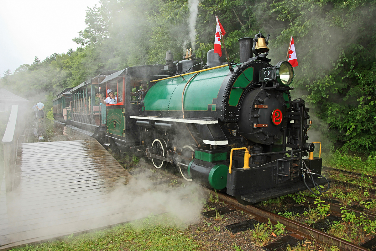 Marge is 79 years young, and as a girl of 20 she had 3 goals in life; she wanted to fly in an airplane, downhill ski and drive a steam locomotive. In those days the first two were pastimes of the wealthy only, but as time carried on she did both, and ended up flying all over the world with her consulting business. The locomotive operation eluded her and all too soon steam gave way to diesels, and she thought her chance had gone for good. Then this year Muskoka Heritage Place announced the Portage Flyer Engineer for a Day program, and she was the first to jump aboard doing 3 of the 4 runs this Canada Day (she observed for the first run). I swear by the end of the day her cheeks must have been hurting like hell from grinning like a kid in a candy store for hours on end! She even had the opportunity to work the torquey little beast up the 3.5% grade on rain-slicked rails, an experience not to be forgotten I'm sure! Marge, it was an honour and a pleasure to fire for you today!