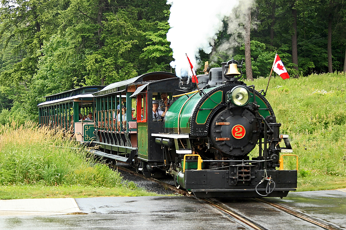 After struggling the little steamer up a 3.5% grade on rain-slicked rails Marge has slowed her to a crawl allowing me to momentarily bail from my fireman's duties to run ahead and take some shots at the crossing. Hopefully you've read how Marge spent her Canada Day (and why) in the other shots I've posted today so that huge grin on her face as she lets loose on the 5-chime won't need further explanation!