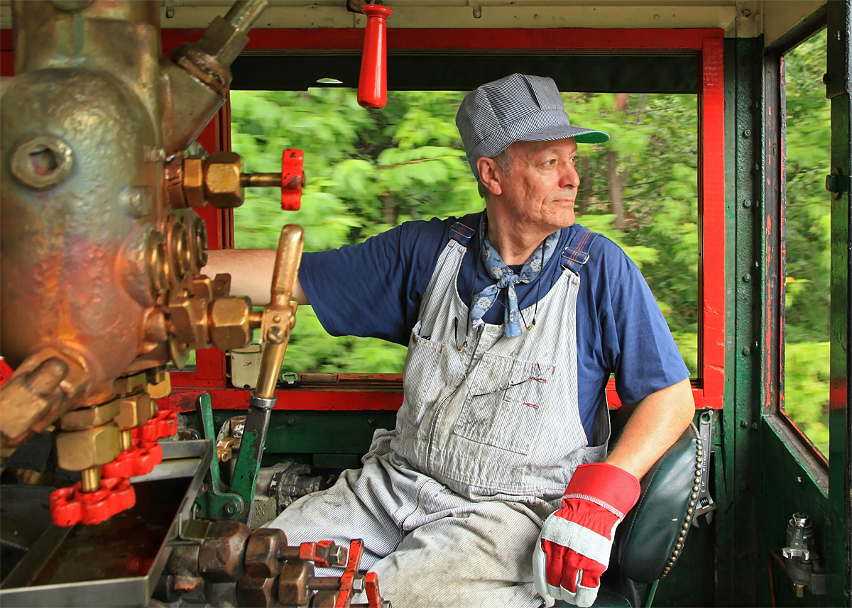 The second customer for our Engineer for a Day program, Brian has made a dry run light power up the line to Fairy Lake and is now backing up to Rotary Village Station to make his first revenue run.