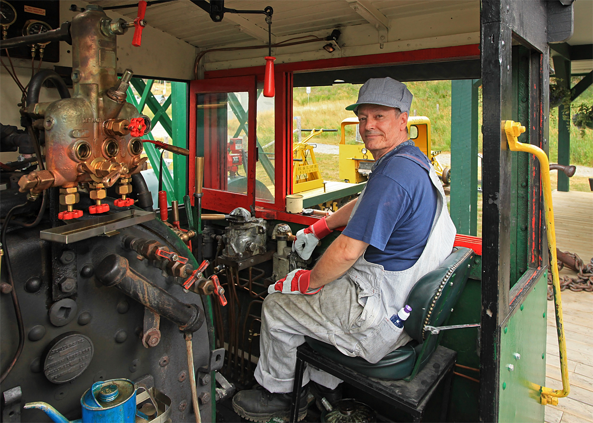 After successfully completing his second revenue run "Engineer for a Day" Brian looks pleased as he takes a break at Rotary Village Station.
