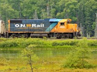 Heard this guy blowing for the crossing in Utterson while I was out running the dogs. Managed to get two of them back in the house, the third in the car and down to this spot before the train got here. This area is the wetlands that form the bottom tip of Siding Lake just south of Martins, and the train is on the causeway crossing between these wetlands and the main body of the lake. Unfortunately he was slowing considerably, so I was unable to get the pan effect I was hoping for, but there's still enough to make the train stand out from the landscape.