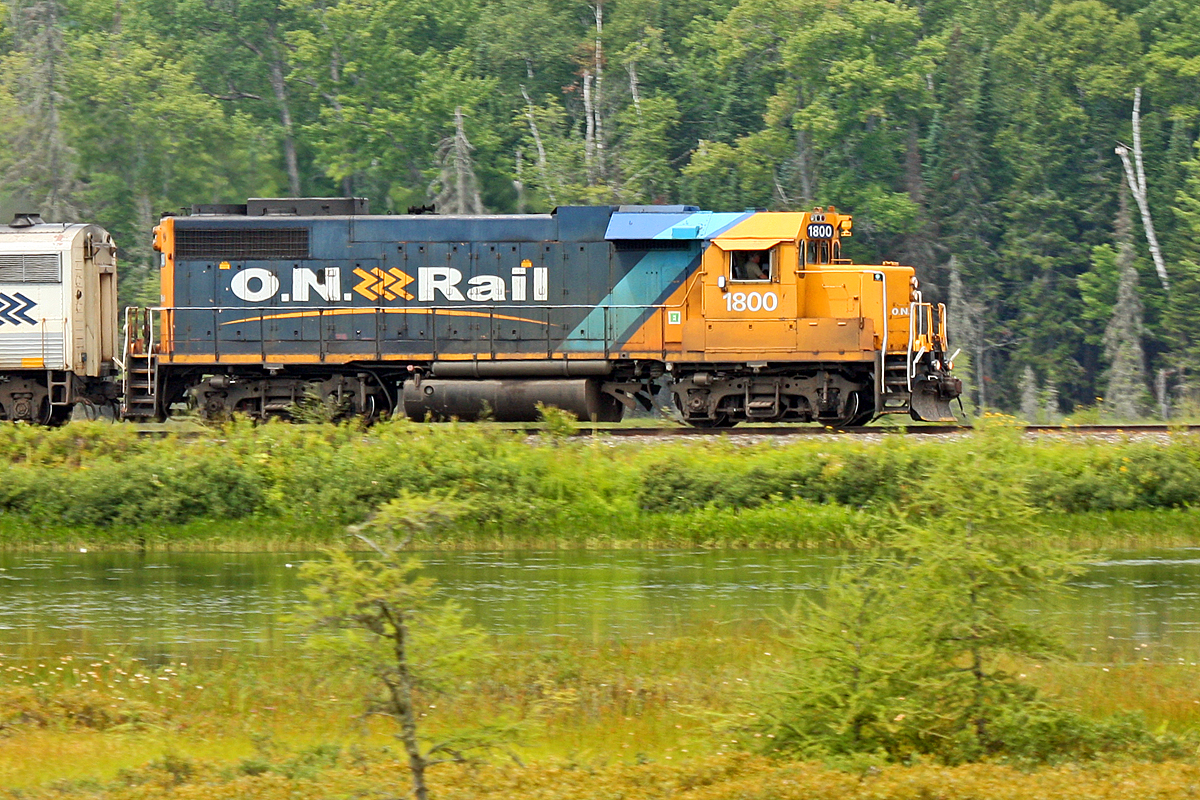 Heard this guy blowing for the crossing in Utterson while I was out running the dogs. Managed to get two of them back in the house, the third in the car and down to this spot before the train got here. This area is the wetlands that form the bottom tip of Siding Lake just south of Martins, and the train is on the causeway crossing between these wetlands and the main body of the lake. Unfortunately he was slowing considerably, so I was unable to get the pan effect I was hoping for, but there's still enough to make the train stand out from the landscape.