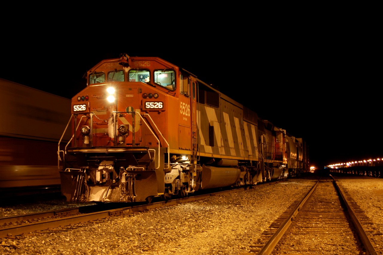 Eastbound CN 416 awaiting another train entering the yard to departure after that with, according myself, 2 very nice engine; CN SD60f #5526 and an CN SD40u #....