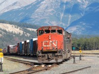 CN 417 leaving Jasper Yard with a great consist; CN SD40-2w #5252 and IC SD70 #1005. We can see the beautiful Canadian Rockies on behind.