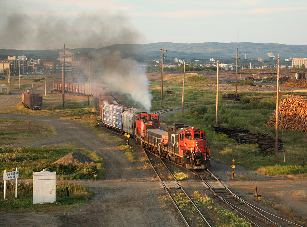 After talking with the crew of this very nice lash up (GP9m, slug, GMD1), they ham it up for the photo with a plume of smoke.