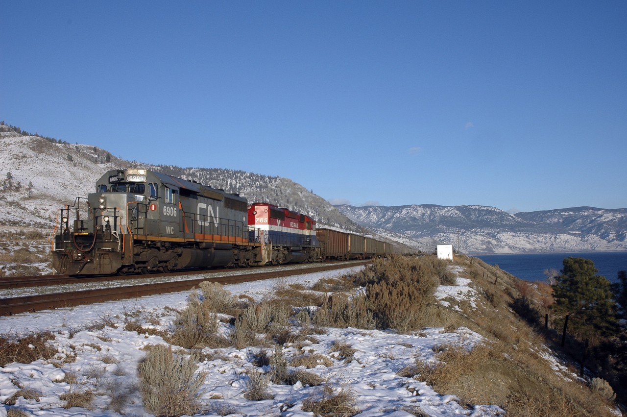 Strangers in a strange land, WC 6906 and BCR 765 lead a westbound CN coal load at Savona in great winter light.