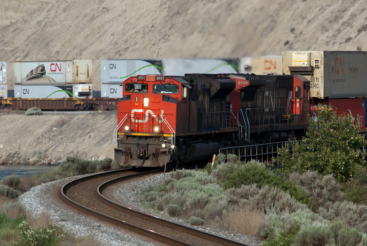 CN 8831 is in the process of crossing the Thompson River Bridge east of Ashcroft, BC