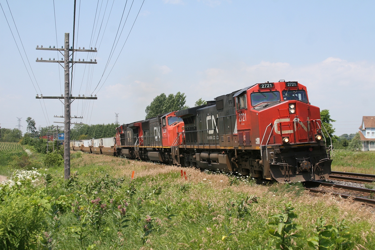 After being overtaken by VIA 60 and meeting VIA 51 at Clarke, CN 106 gets underway slowly climbing the grade out of Clarke with VIA 44 fast approaching behind him