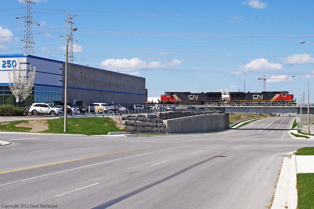 A fresh crew of a late 106 approaches the Uxbridge sub at Hagerman's south of Unionville Ontario.