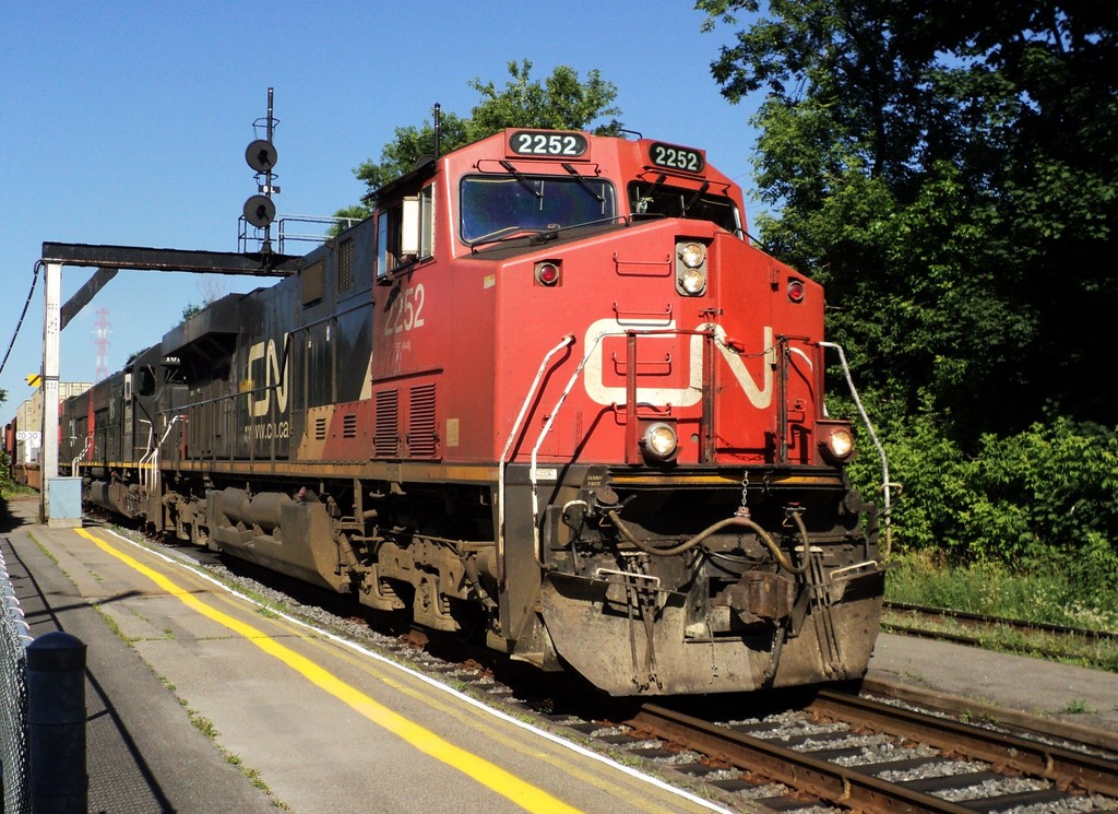 CN-2252 -ES-44-DC on south main track going to Halifax N.S on rte 120  behind loco ILLINOIS CENTRAL 1015 could not take a good picture