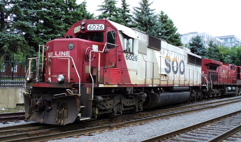 SOO LINE 6026 EMD SD-60 affiliated with Canadian Pacific owner was in Montreal harbor leading loco first time that I have see a SOO loco in harbor  photo loco on switch had to walk the loco did not come to open space was behind fence pass caméra in between fence