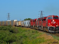 CP 8907 leads a quartet of GE's on CP 441 around the bend in Tilbury on its way into Windsor.
