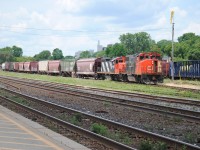 The Marshling Yard train of brantford is working in the station dropping off all it's cars. Notice that all it's cars are Hoppers.