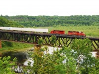 CP Expressway #121 with 5857 & 5879 on Mud Lake Trestle mp 27.5 Belleville Sub 
