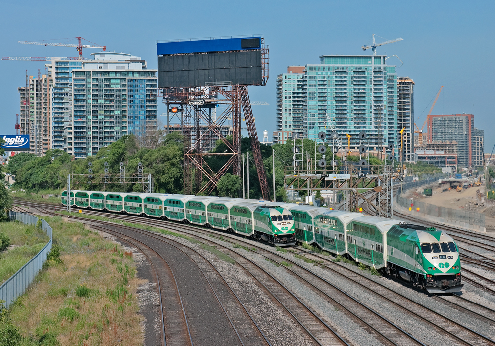 Two GO trains meet right on the border between the USRC and Oakville Sub.  A lot has been going on in the past recent years, new condos, the passing of the guard between the F59's and MP40's. Now in the middle right, the fly under at Strachan Ave which will hold 8 tracks for the airport rail link expansion and all day GO train service in the near future.