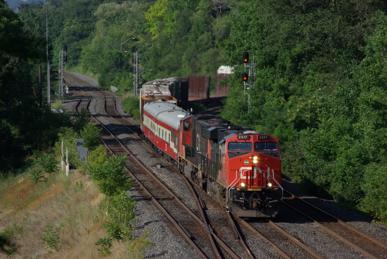 CN 2317 leads train #148 through Bayview with 2 business cars and some manifest freight on the head end.