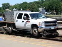 A Loram High Rail Truck cruises by on the South Track at Brantford Ontario.  It and a CN truck were inspecting the Dundas Subdivision.  The Loram truck was from Minnesota as noted by the license plate.  With one of these trucks checking the tracks it means that a grinding train may be crossing these rails in the near future.  They had to make it to CN Masseys before Via 72 and CN 332 reached the station. 