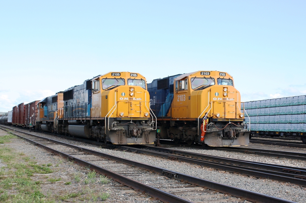 As train 214 with ONT 2105 leading builds its air pressure for the trip to North Bay, the Englehart Yard job with ONT 2103 on the point rolls alongside 214 making for a neat meet.