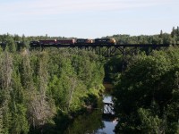 ONT 2103 leads train 214 across the Englehart River just South of the town of Englehart on the ONR Temagami Subdivision