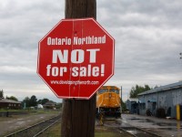 Stormy skies are approaching Englehart Ontario on this Saturday morning.  Stormy skies are also on their way to the Ontario Northland Railway.  In March the Ontario government announced that they would be divesting the Ontario Northland.  After the announcement signs like these popped up all over Norhtern Ontario.  To learn more about this please visit the website on the sign.