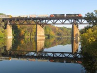An Eastbound C.N. freight crosses the Grand River at Paris, Ont.