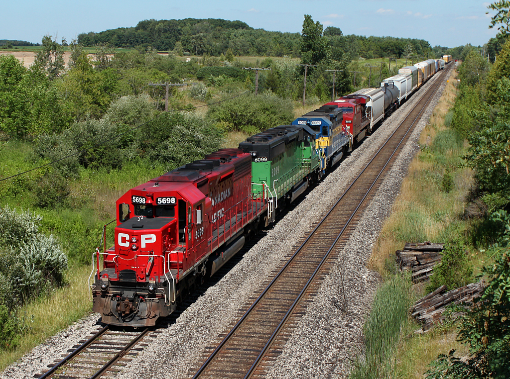 CP 243 pulls into Coakley siding with a colourful lashup.
