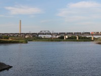 CN L55741 27 ; a Regina, SK - Moose Jaw, SK switcher backs across the massive Moose Jaw bridge for MJ Jct after delivering 5 cars to the CP yard, and picking up the tankers.