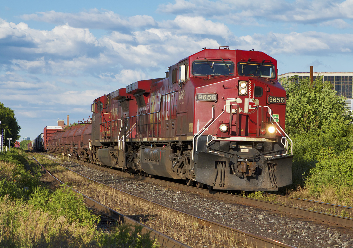 CP 254 heads west through Little Portugal with work in Lambton YD.