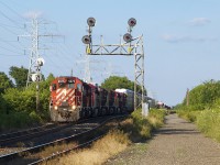 With a heck of a lashup, 423 throttles up under the classic staggered aspects at Bartlett. Lashup was CP 6075, 5790, 8860, 8539 9682, 9376, 8559 with the last five GE's for Vaughan Intermodal Terminal.