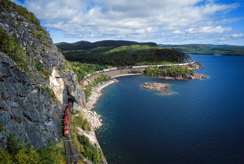 Canadian Pacific train No. 409 curves through Mink Tunnel along the spectacular shoreline of Lake Superior at Coldwell, Ontario. In my notebook from 1993, it says it was a one hour climb up to this viewpoint, and another hour down; and I was a lot younger back then too!