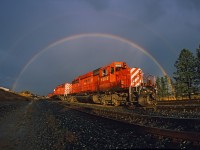 Under the rainbow:  A double rainbow encircles a pair of venerable CP Rail SD40-2s after a good rainstorm in Cranbrook, British Columbia, on October 4, 2010. This image was on one of my last rolls of film before the switch to digital.  