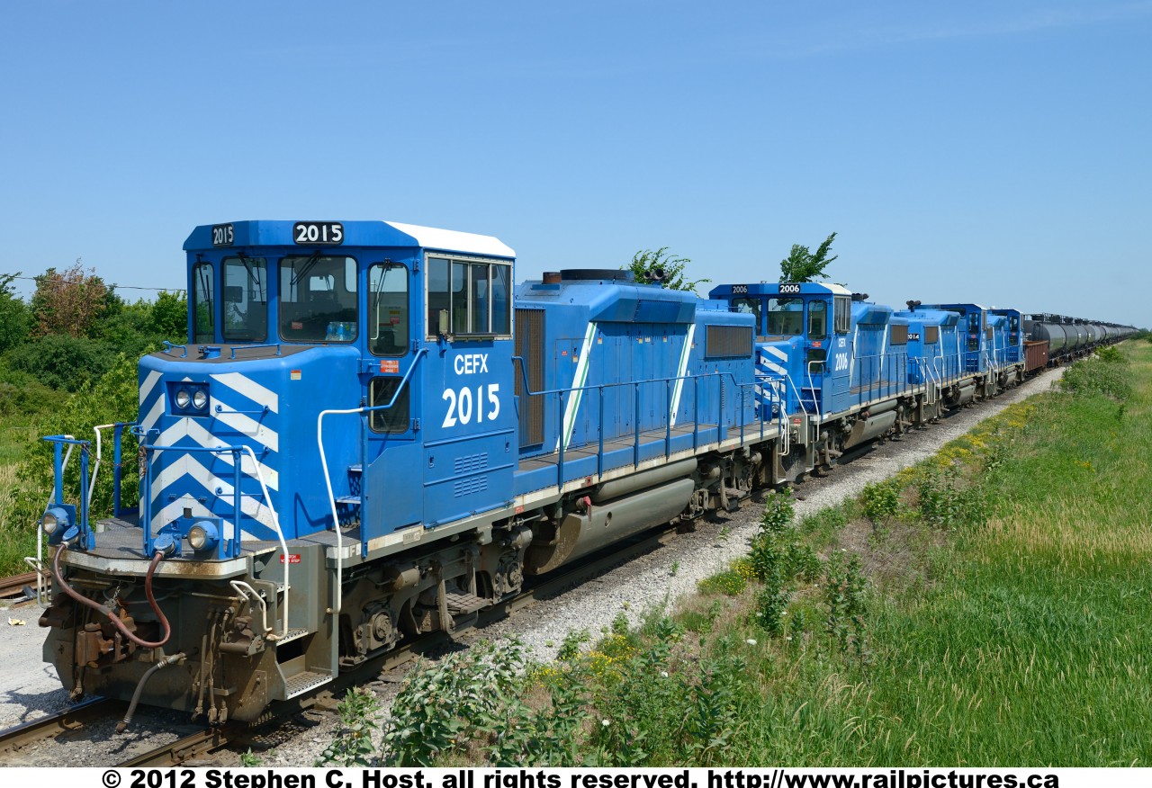 Four GP20D's (2019, 2014, 2006, 2015) make up a matching set of power on SOR 598. The train sits parked at the Garnet yard/station, waiting for the crew of the day yard switcher (599) to arrive.. The SOR Hagersville sub is very busy these days, 599's duties are to switch US Steel Lake Erie and Imperial Oil, and crew informed me that a night job also switches Imperial Oil